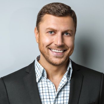 broadly smiling handsome young businessman
