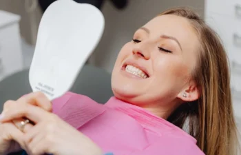 Happy patient enjoying safe sensitive teeth whitening treatment in Marietta